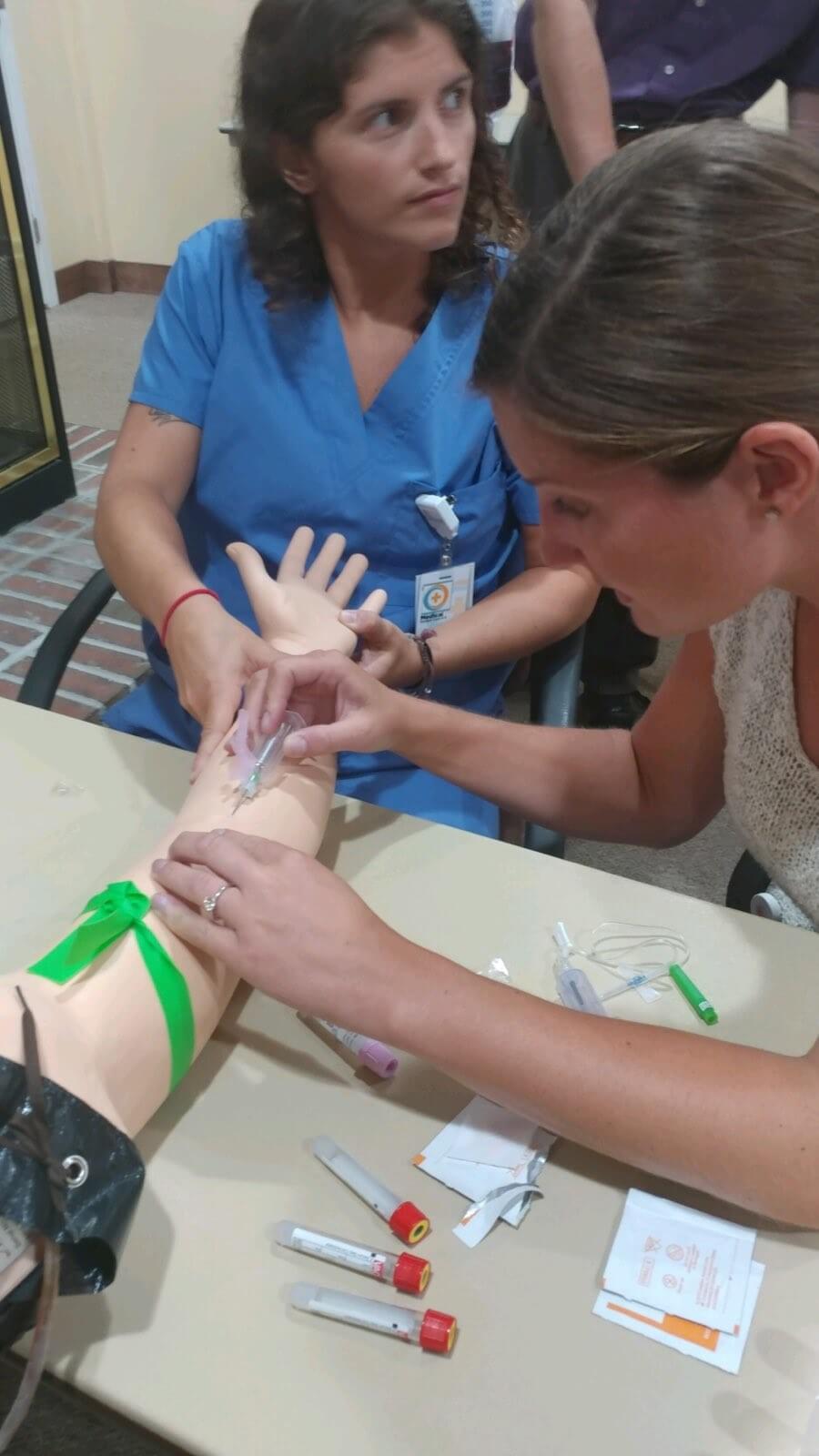 medical student training with needles